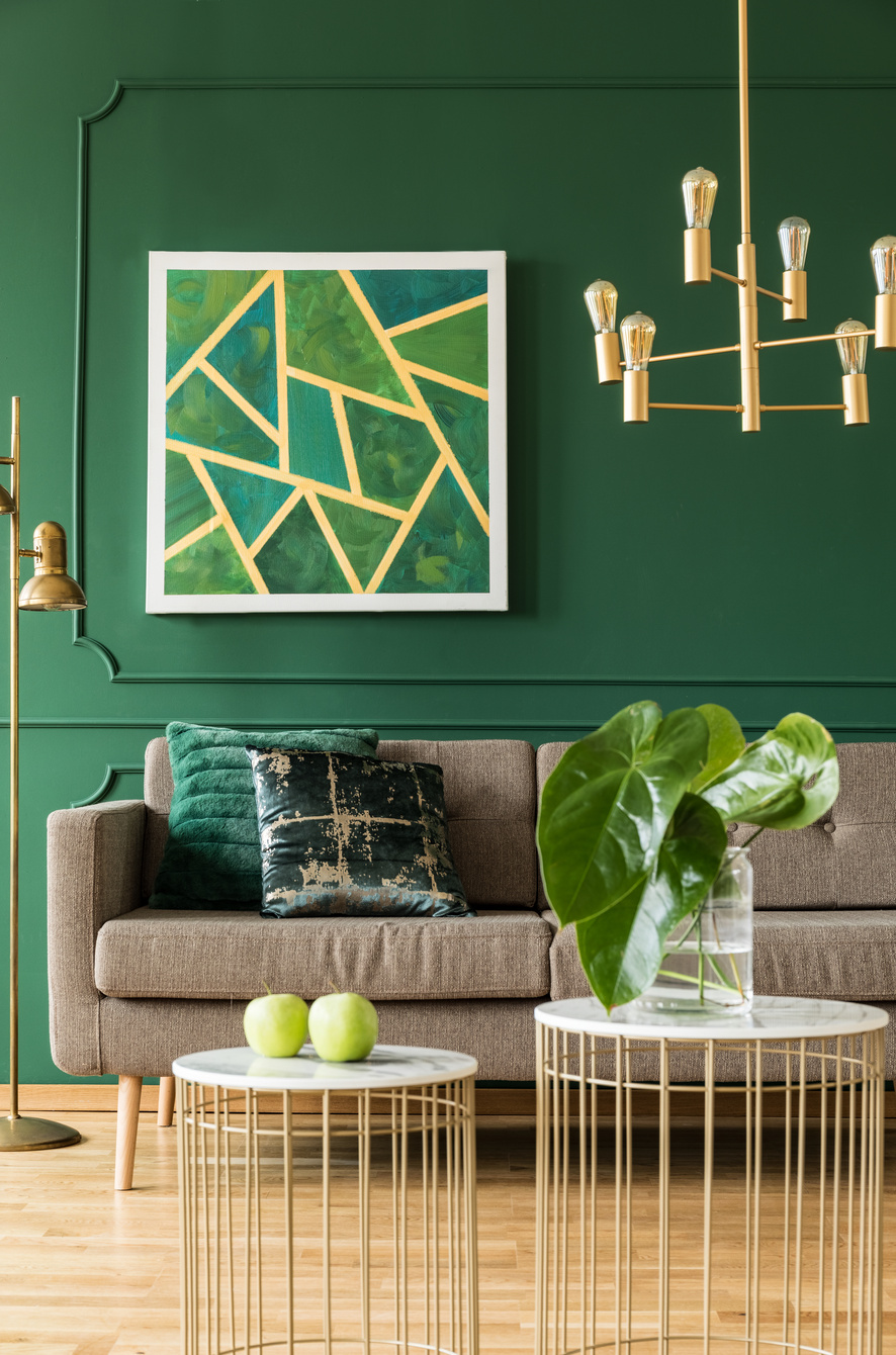 Gold details in green living room interior